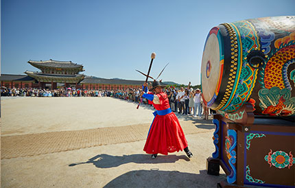 3. The first sound of the drums (beating the big drum three times).